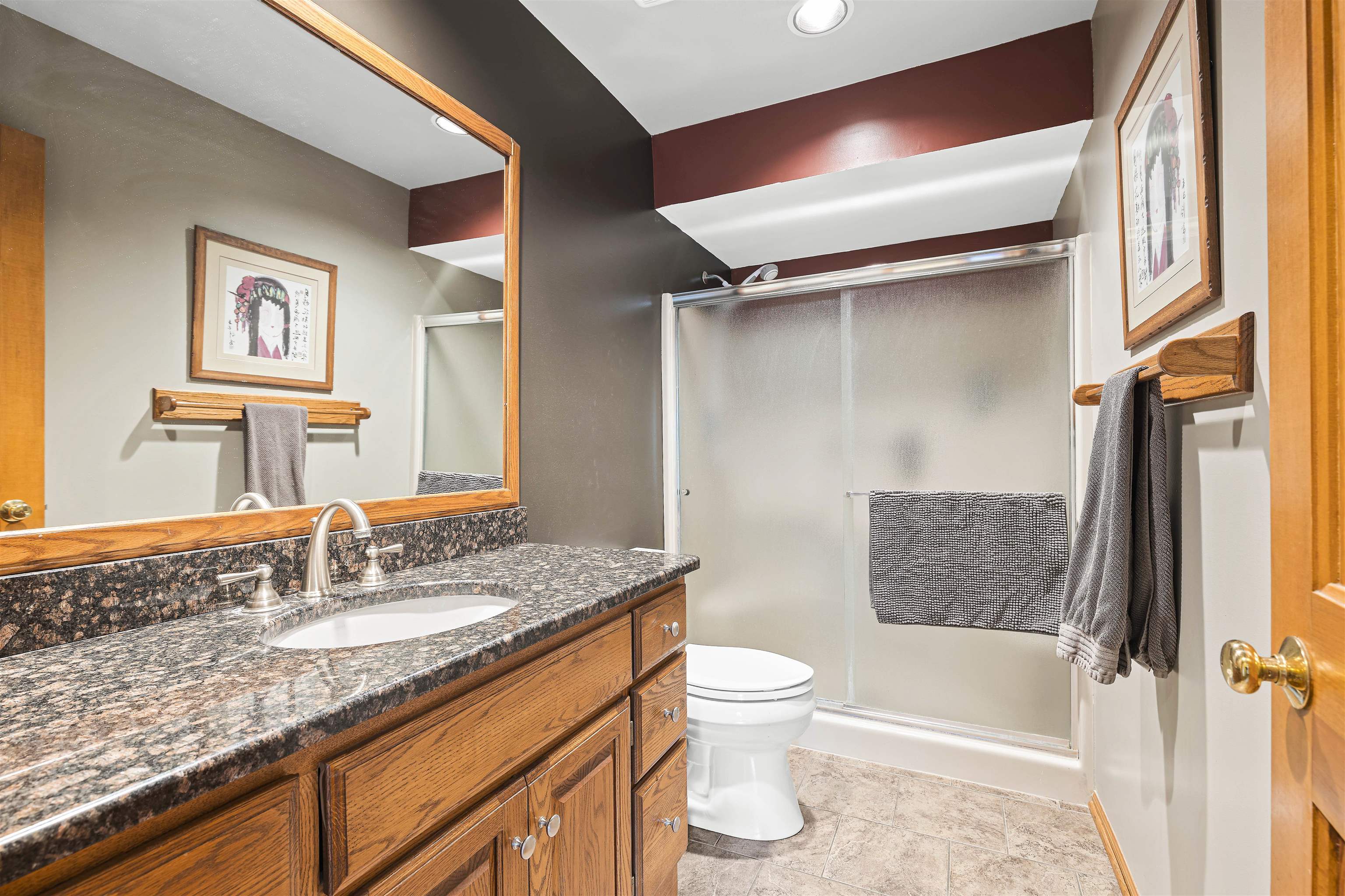 3410 Rotary Road Rockford, IL 61109 - Photo 24 of 65 a bathroom with a granite countertop sink toilet and shower