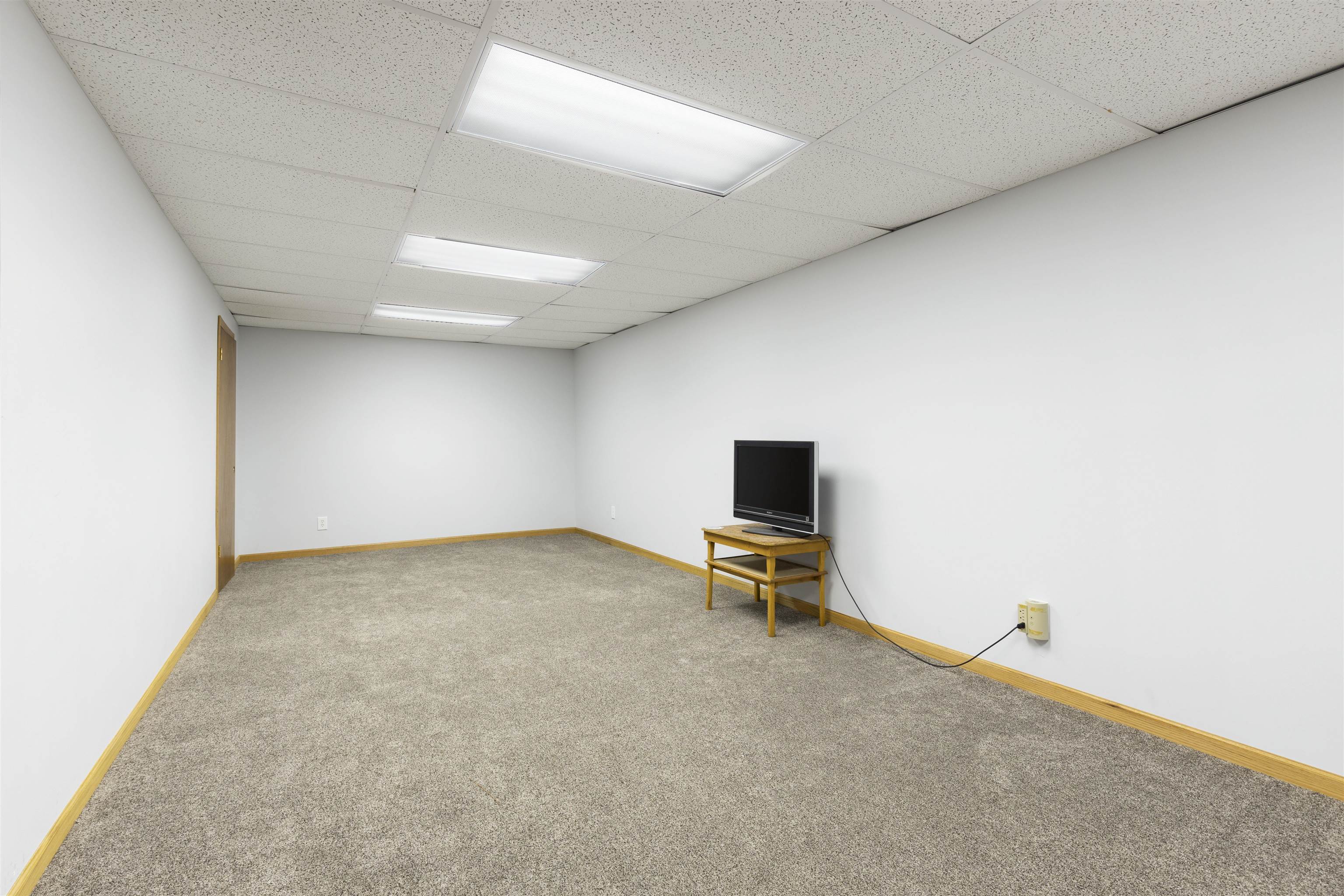 3410 Rotary Road Rockford, IL 61109 - Photo 34 of 65 a view of a livingroom with a projector and furniture