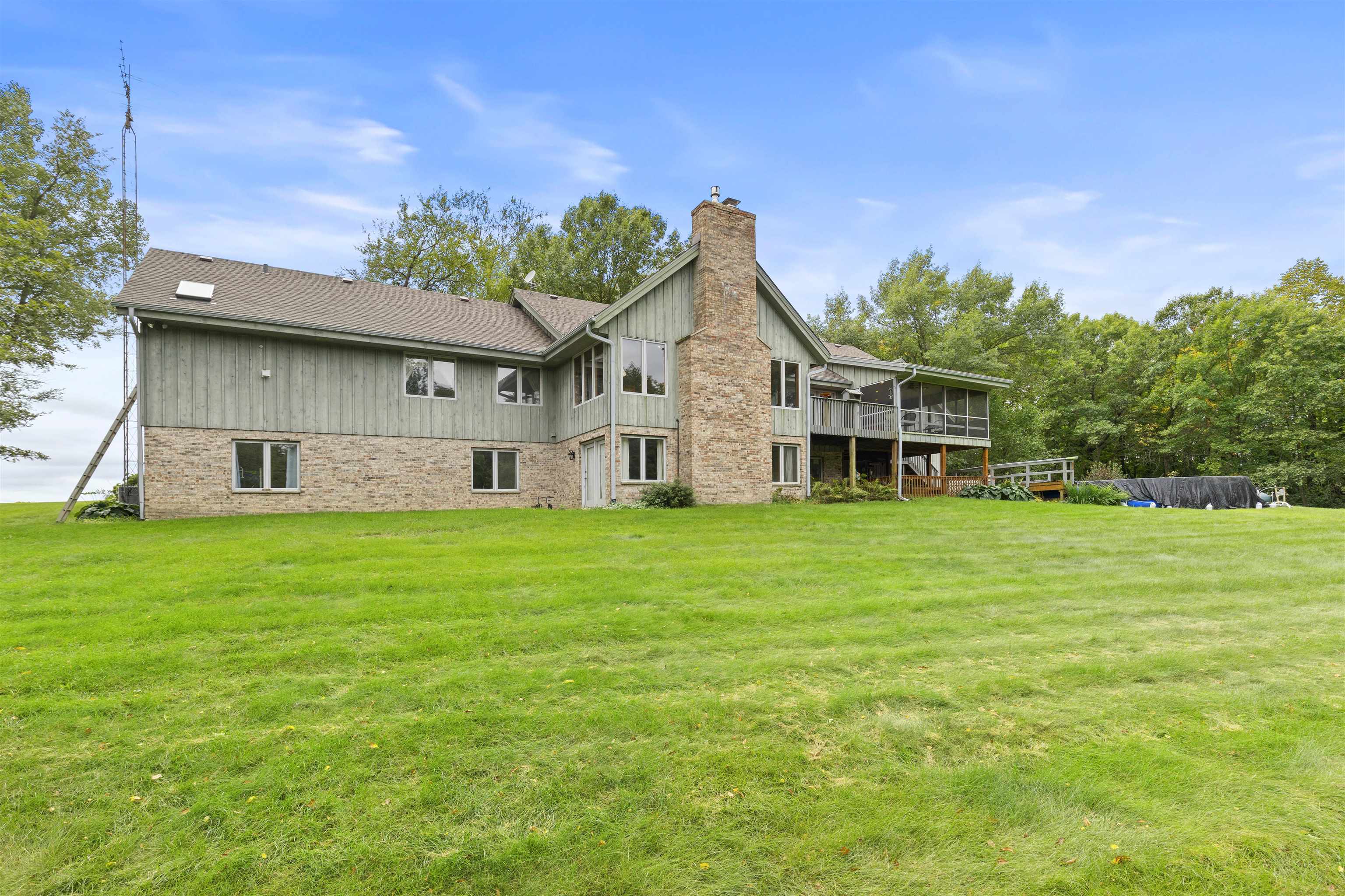 3410 Rotary Road Rockford, IL 61109 - Photo 39 of 65 a front view of a house with a big yard and potted plants