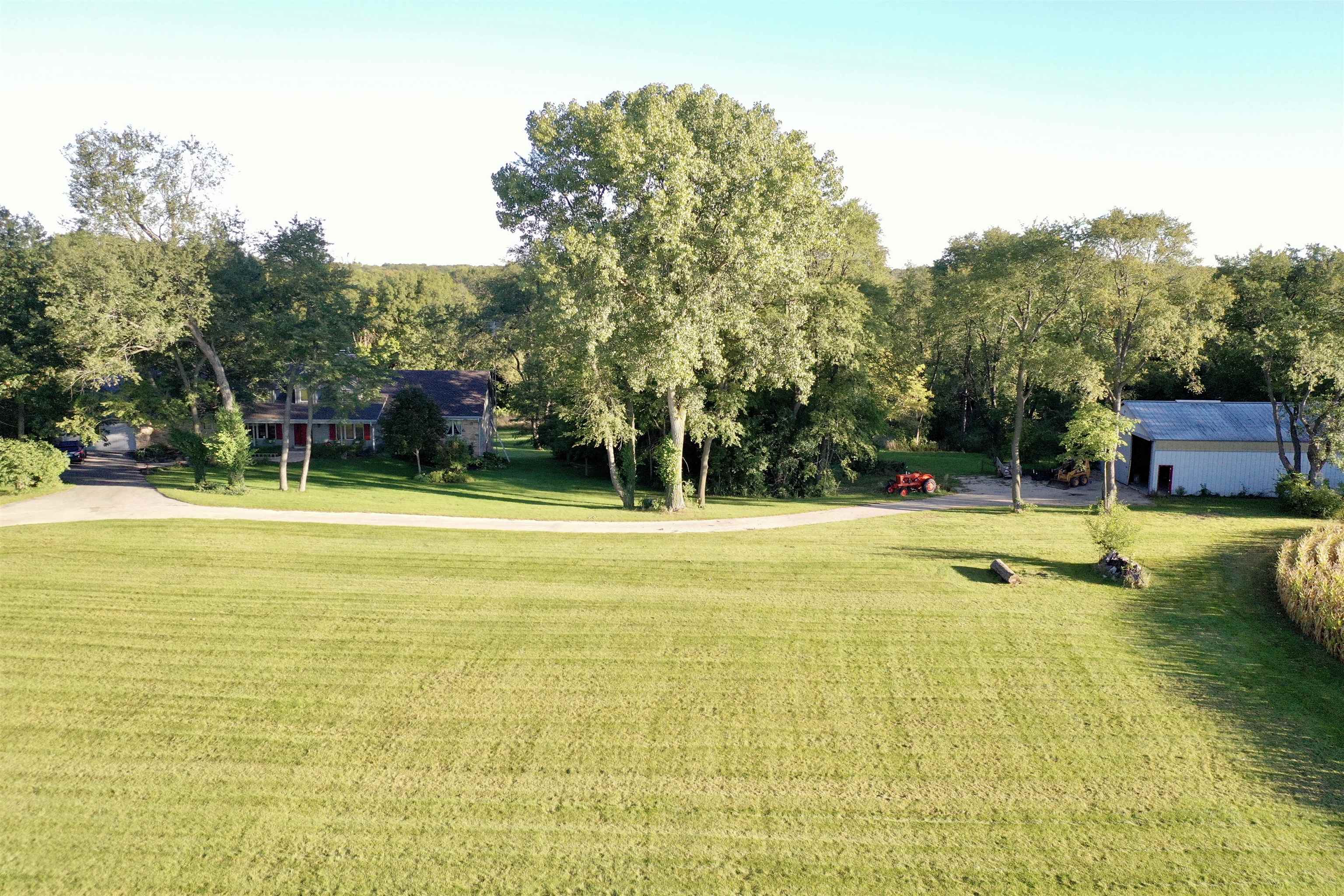 3410 Rotary Road Rockford, IL 61109 - Photo 44 of 65 a view of a swimming pool with an outdoor seating and a yard