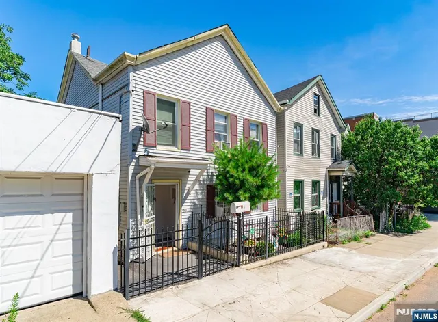 a front view of a house with yard