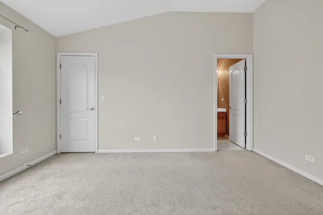a white toilet sitting next to a bath tub and a shower