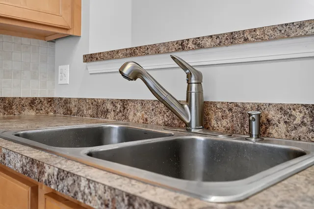 a view of a refrigerator in a kitchen