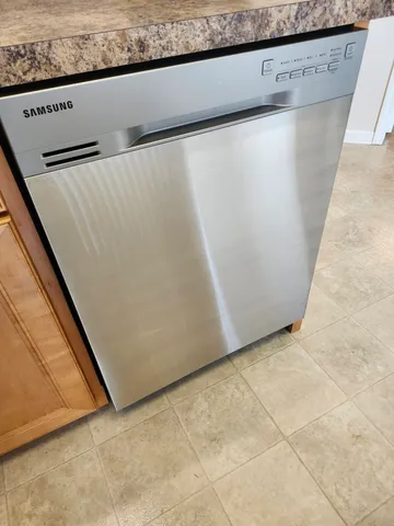 a view of a hallway with a refrigerator