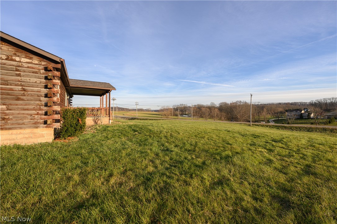8200 Cutler Road Southwest Sherrodsville, OH 44675 - Photo 7 of 26 View of green lawn featuring a view of countryside