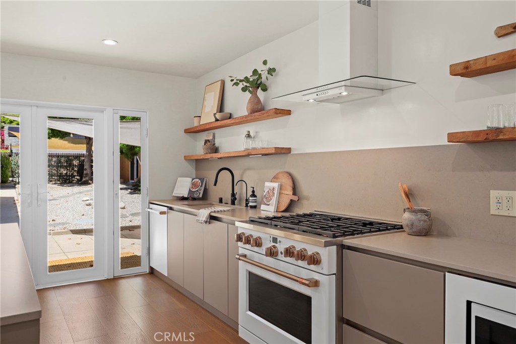 1445 Paloma Street Pasadena, CA 91104 - Photo 11 of 44 a kitchen with stainless steel appliances granite countertop a stove and a refrigerator