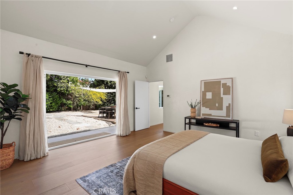 1445 Paloma Street Pasadena, CA 91104 - Photo 15 of 44 a bedroom with a bed and glass door