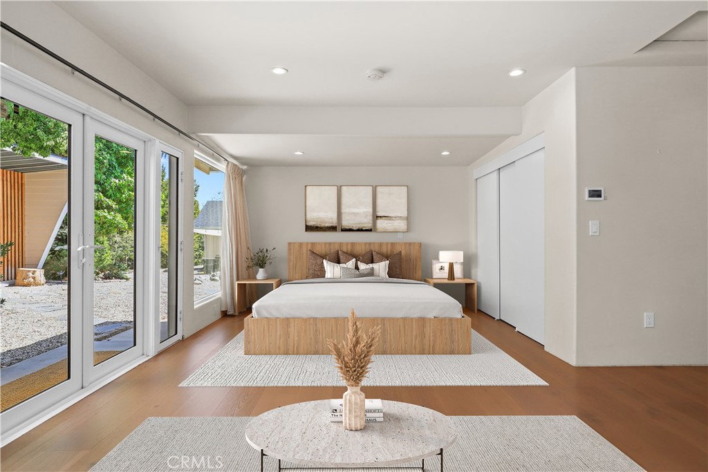 1445 Paloma Street Pasadena, CA 91104 - Photo 38 of 44 a bedroom with a large bed and a wooden floor