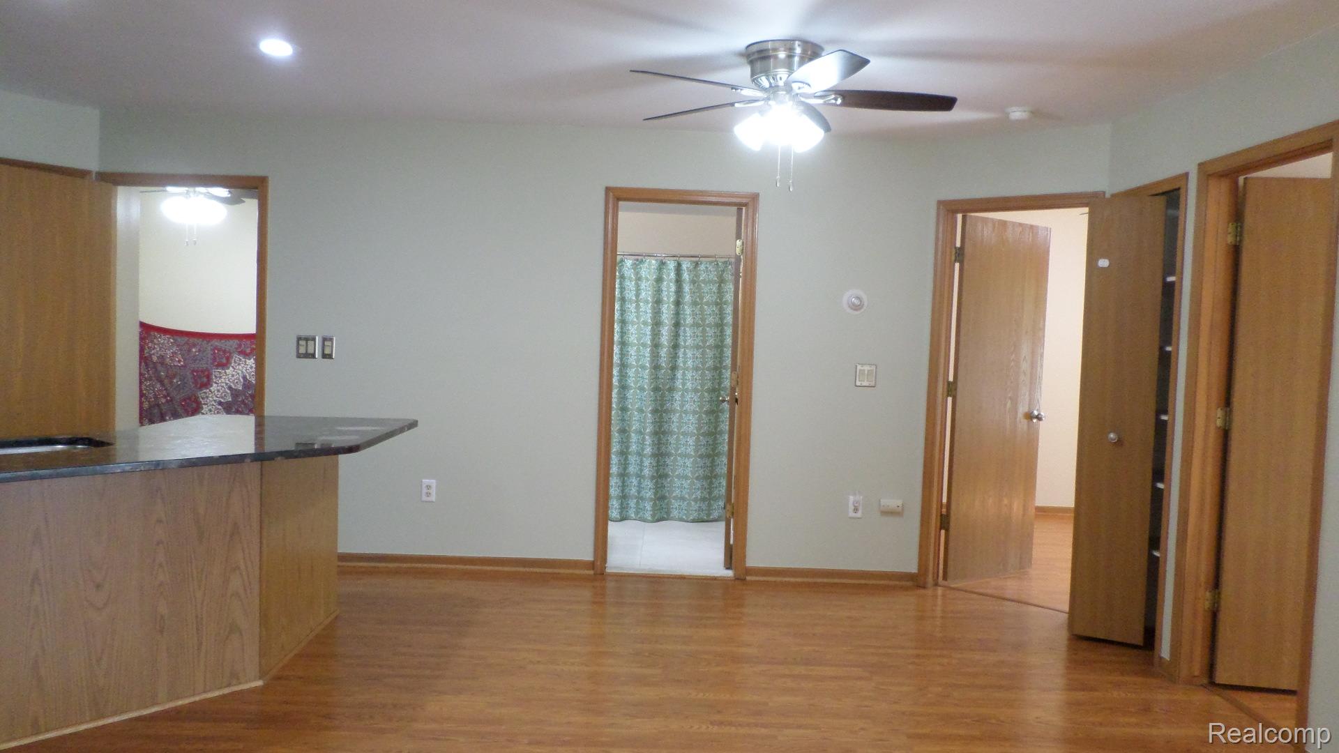 33831 Hooker Road, Unit 6 New Baltimore, MI 48047 - Photo 5 of 34 Kitchen featuring light wood finished floors and a ceiling fan