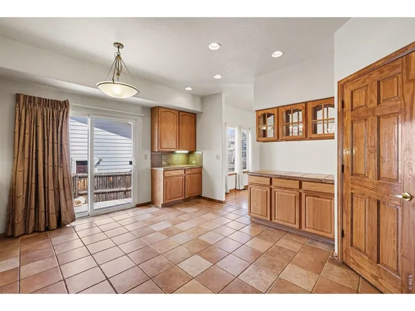a open kitchen with a sink a stove and cabinets
