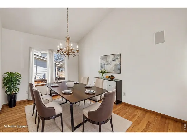 a view of a dining room with furniture and window