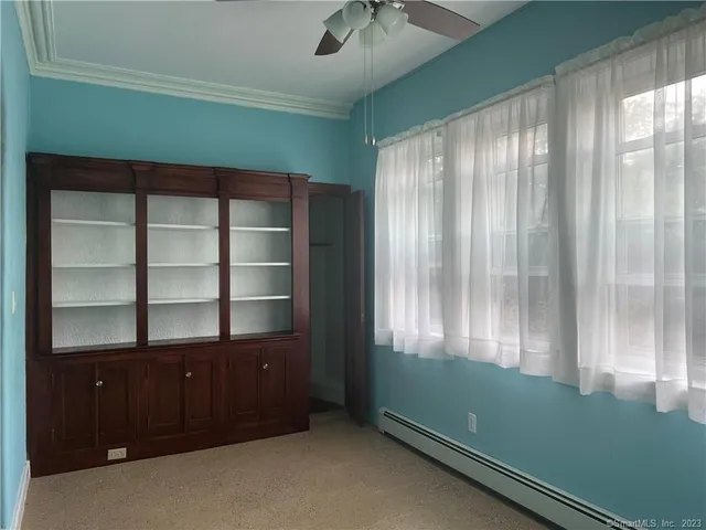 a room with window and walk in closet