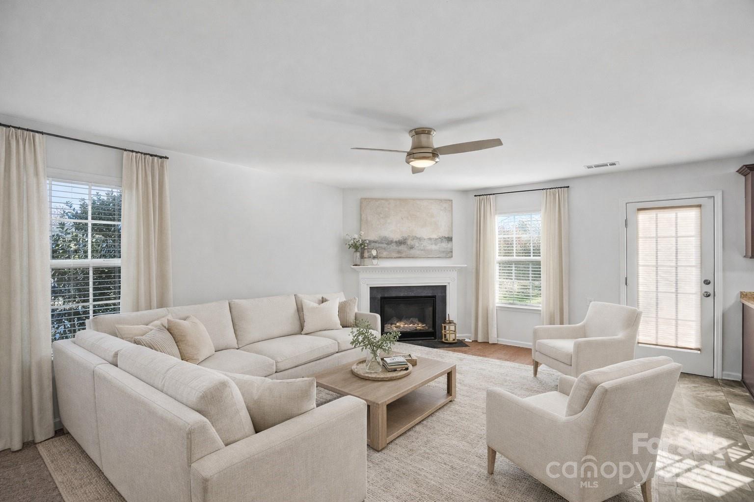 4146 Trowel Court Midland, NC 28107 - Photo 11 of 29 a living room with furniture and a fireplace