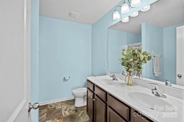 a white bath tub sitting next to a shower