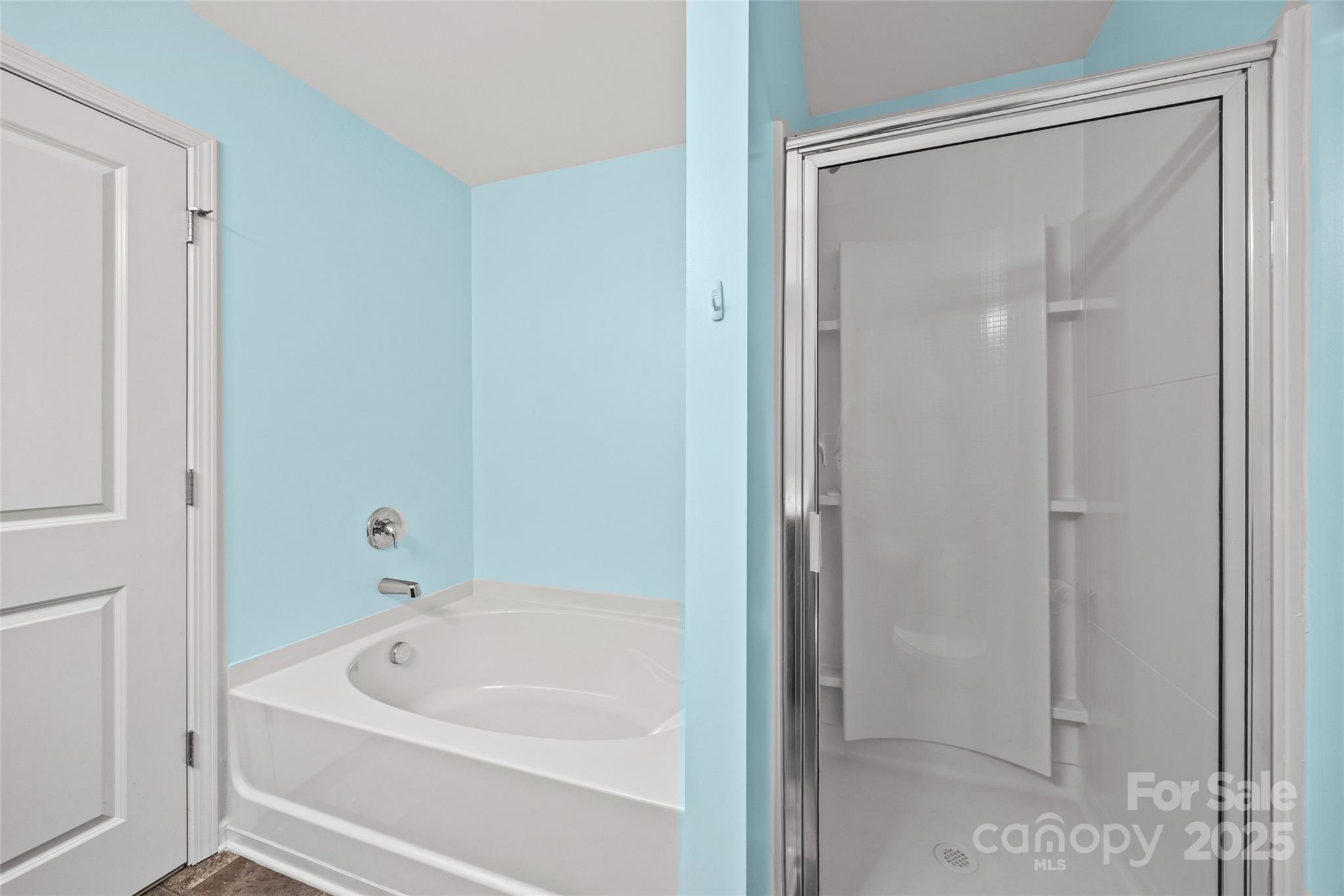 4146 Trowel Court Midland, NC 28107 - Photo 18 of 29 a white bath tub sitting next to a shower