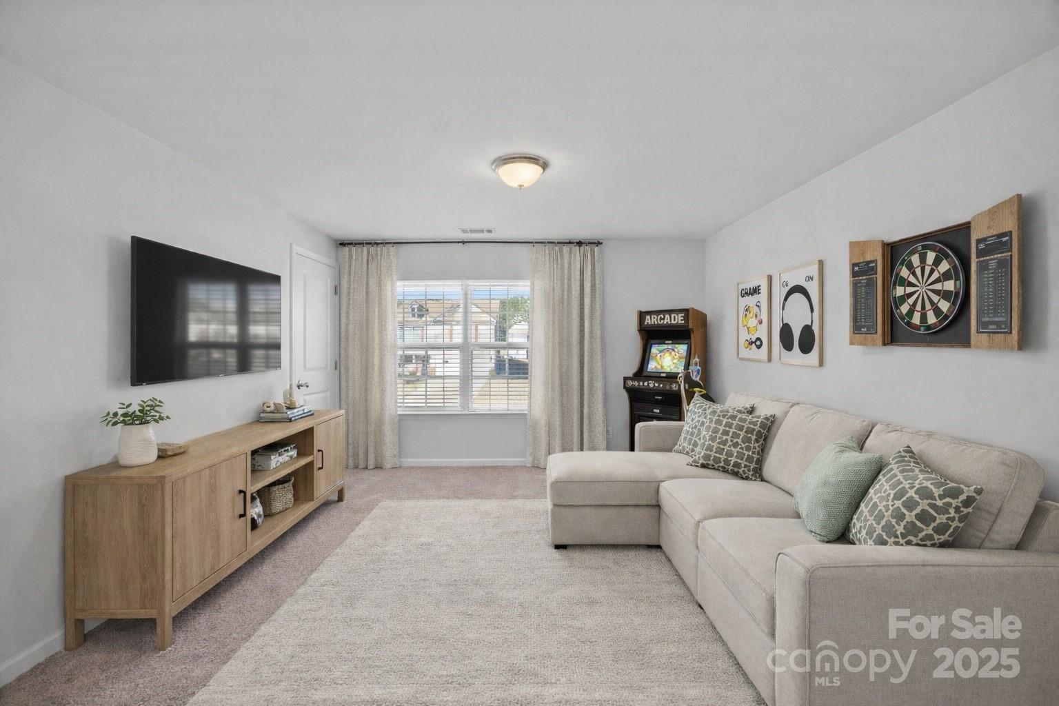 4146 Trowel Court Midland, NC 28107 - Photo 19 of 29 a living room with furniture and a flat screen tv