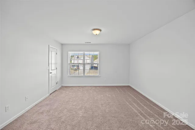 a bathroom with a granite countertop sink a large mirror and shower