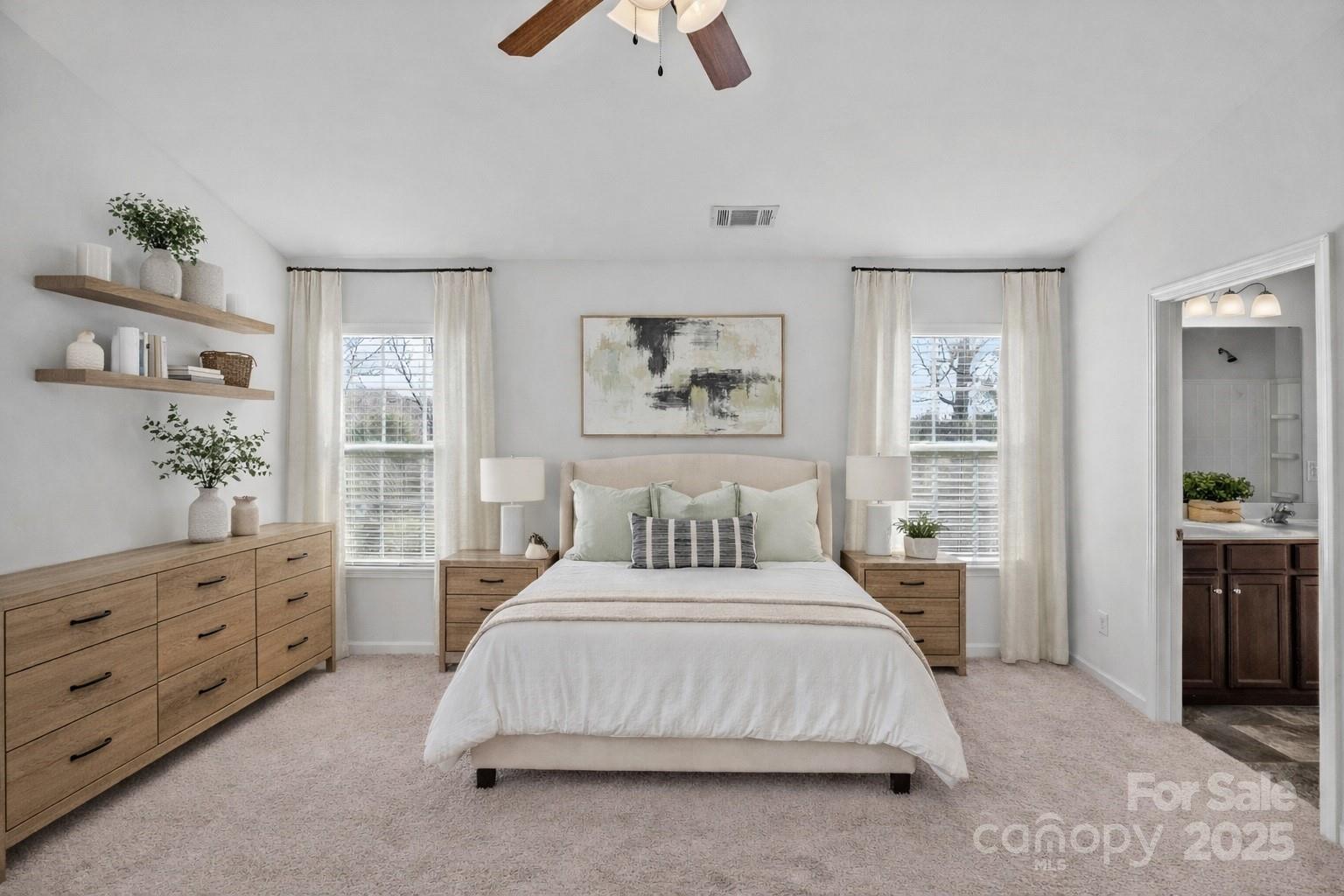 4146 Trowel Court Midland, NC 28107 - Photo 21 of 29 a bedroom with a large bed a chandelier and a window