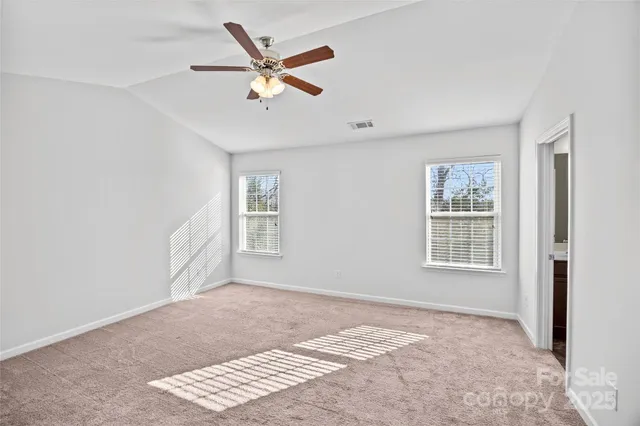 a bathroom with a sink double vanity granite tub shower and a mirror