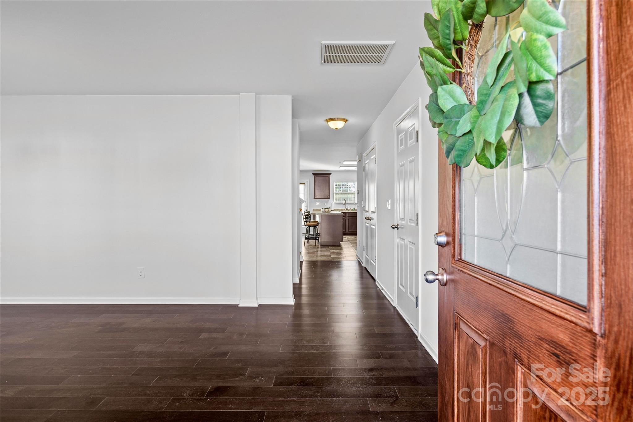 4146 Trowel Court Midland, NC 28107 - Photo 3 of 29 a view of a hallway with wooden floor and plant