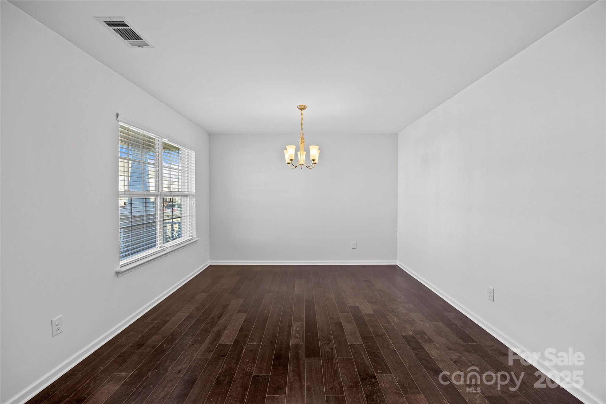 4146 Trowel Court Midland, NC 28107 - Photo 4 of 29 wooden floor in an empty room with a window