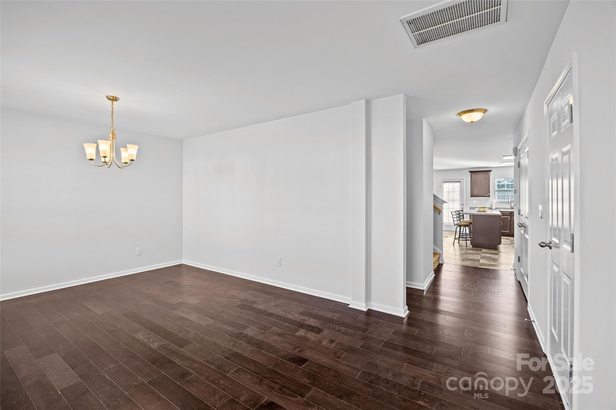 4146 Trowel Court Midland, NC 28107 - Photo 5 of 29 a view of a hallway with wooden floor table and chairs
