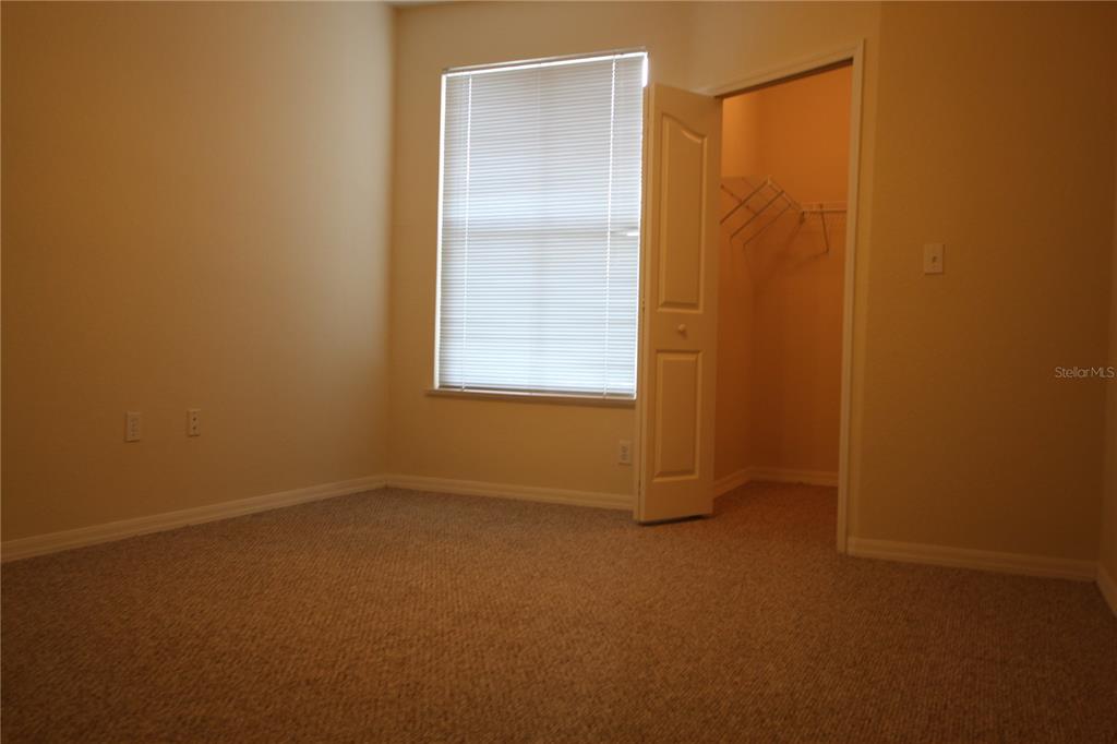 5811 Legacy Crescent Place, Unit 202 Riverview, FL 33578 - Photo 5 of 12 an empty room with windows