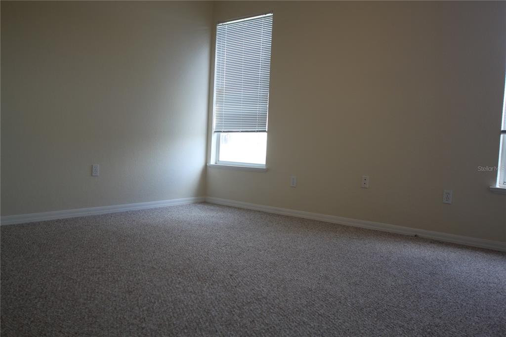 5811 Legacy Crescent Place, Unit 202 Riverview, FL 33578 - Photo 7 of 12 an empty room with a window