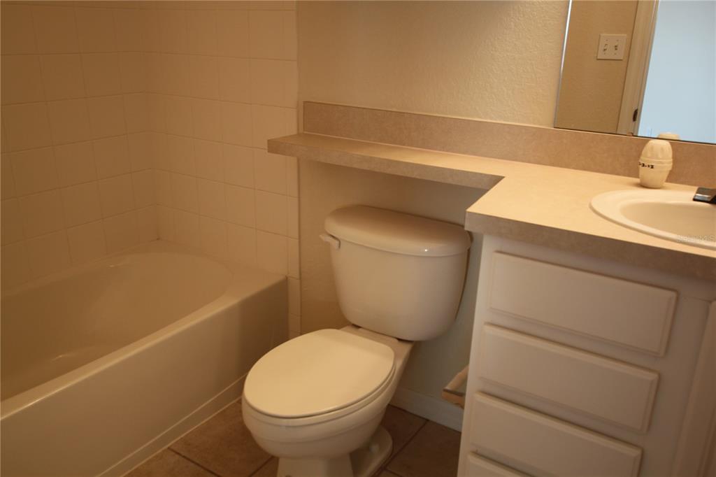 5811 Legacy Crescent Place, Unit 202 Riverview, FL 33578 - Photo 8 of 12 a bathroom with a toilet and a sink