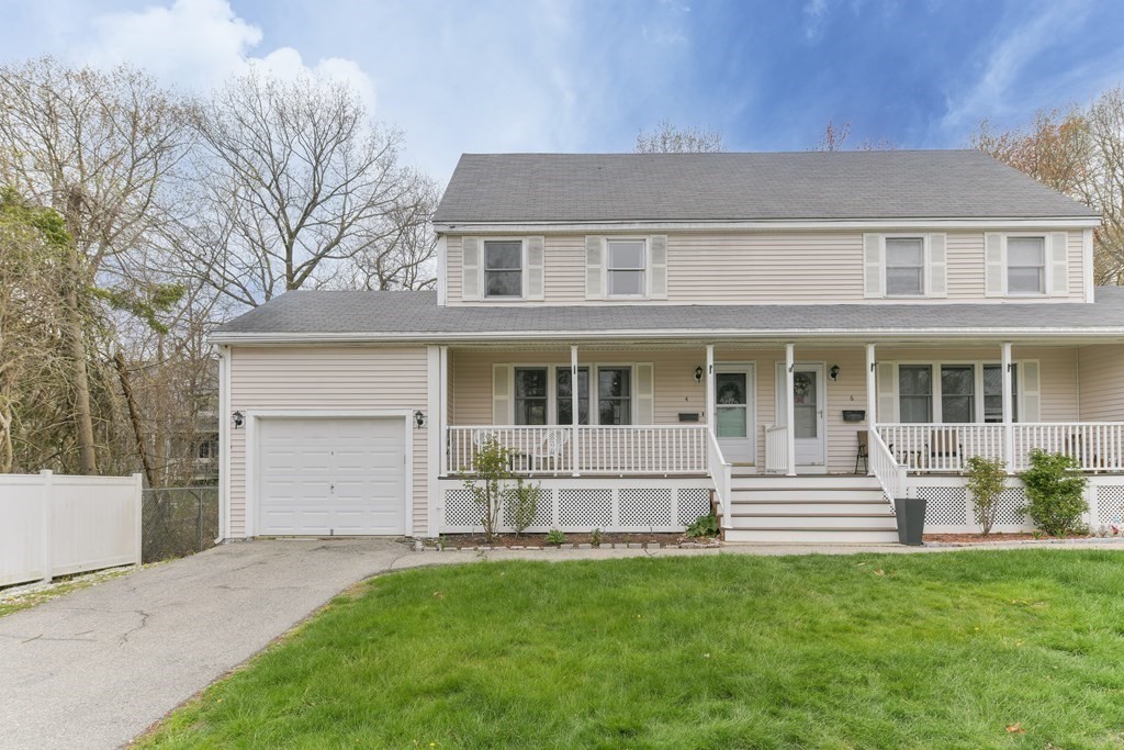 4 Scherig Circle, Unit 4 Methuen, MA 01844 - Photo 14 of 28 a front view of a house with a garden