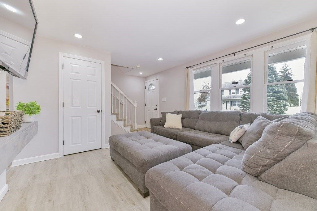 4 Scherig Circle, Unit 4 Methuen, MA 01844 - Photo 17 of 28 a living room with furniture and a large window