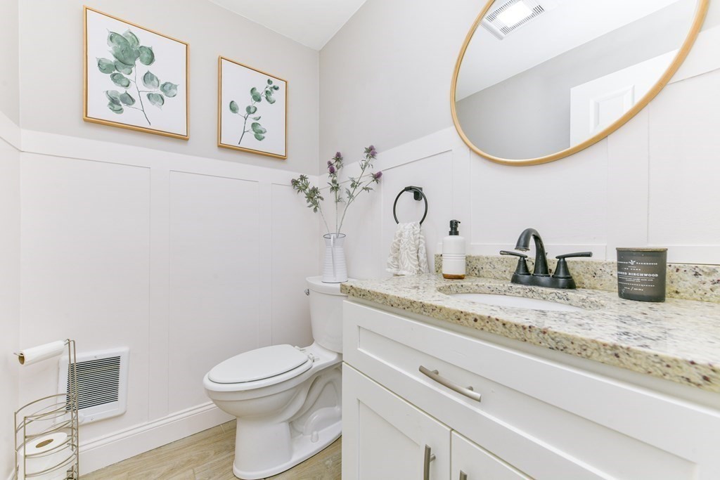 4 Scherig Circle, Unit 4 Methuen, MA 01844 - Photo 19 of 28 a bathroom with a toilet a sink and mirror