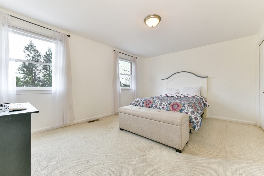4 Scherig Circle, Unit 4 Methuen, MA 01844 - Photo 23 of 28 a bedroom with a bed and window