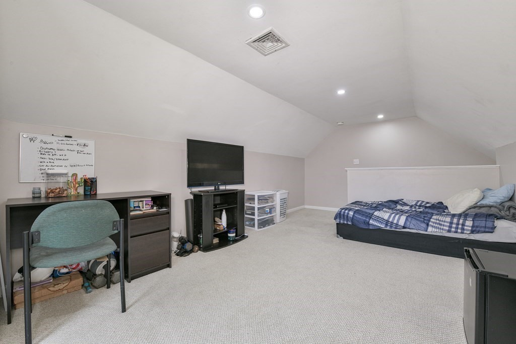 4 Scherig Circle, Unit 4 Methuen, MA 01844 - Photo 25 of 28 a living room with furniture a flat screen tv and a table