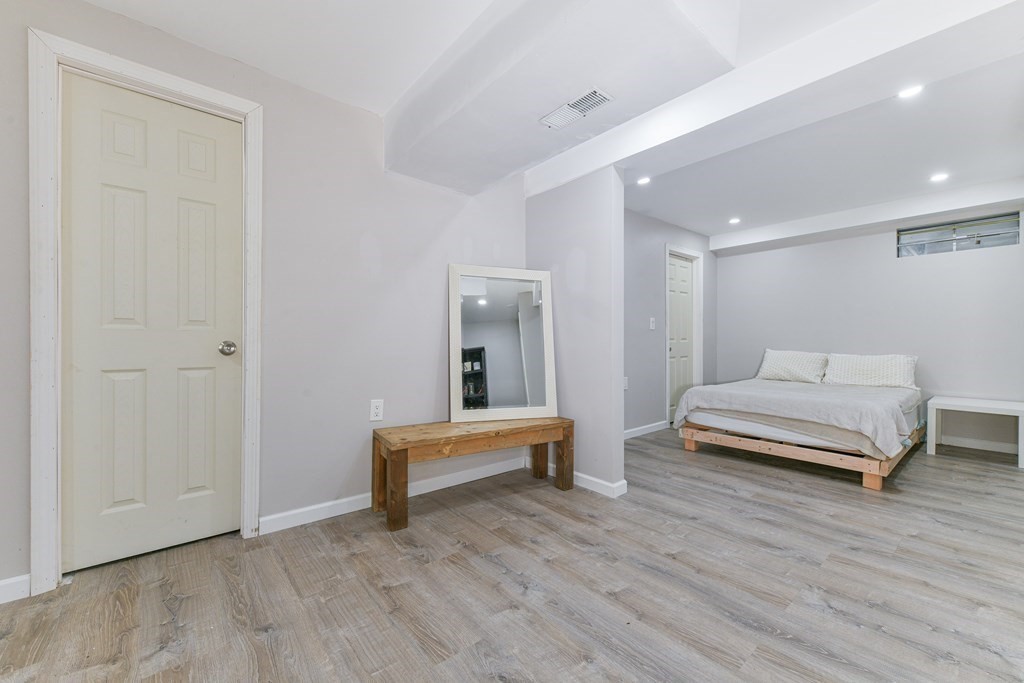 4 Scherig Circle, Unit 4 Methuen, MA 01844 - Photo 26 of 28 a bedroom with a bed and a table