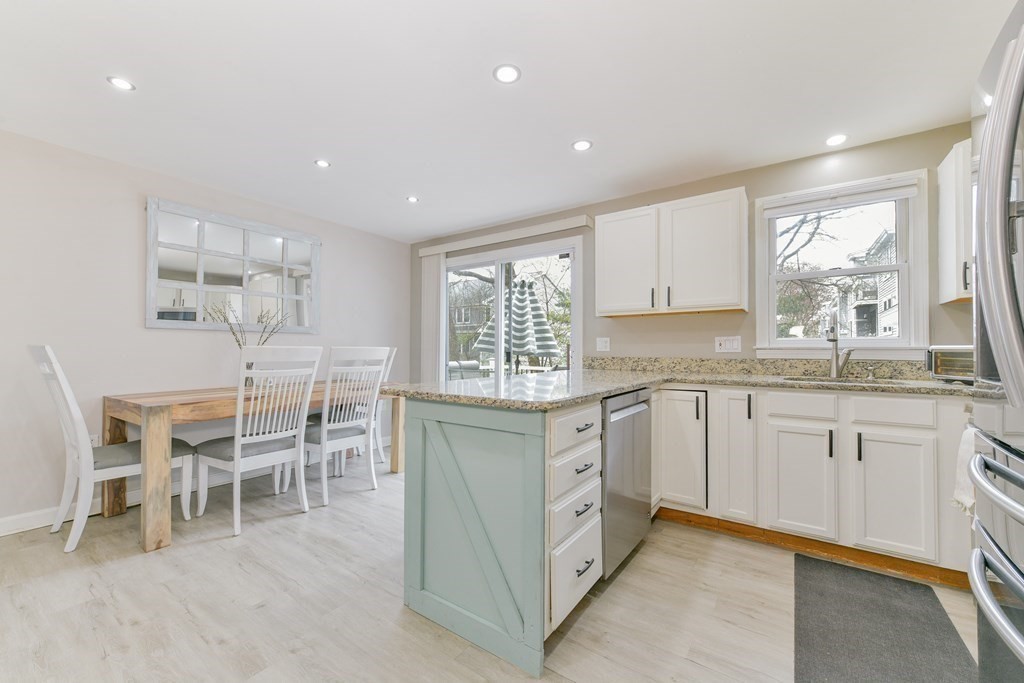4 Scherig Circle, Unit 4 Methuen, MA 01844 - Photo 8 of 28 a kitchen with cabinets and chairs