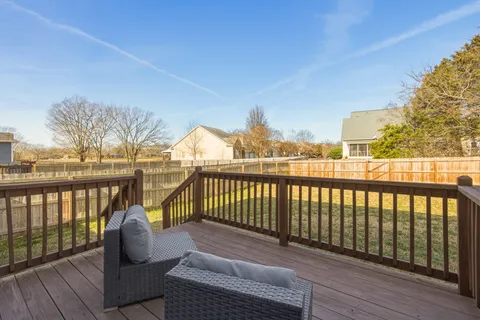 a view of balcony with furniture