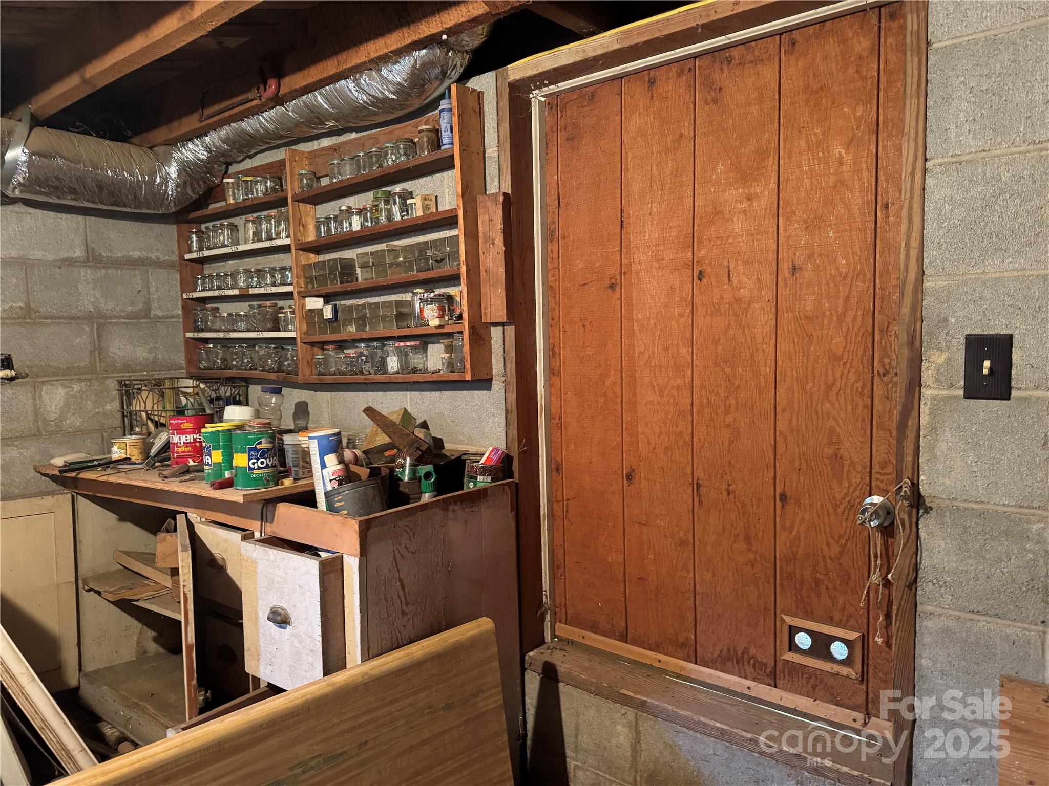 147 Helton Lane Mill Spring, NC 28756 - Photo 23 of 25 a room with storage and utility