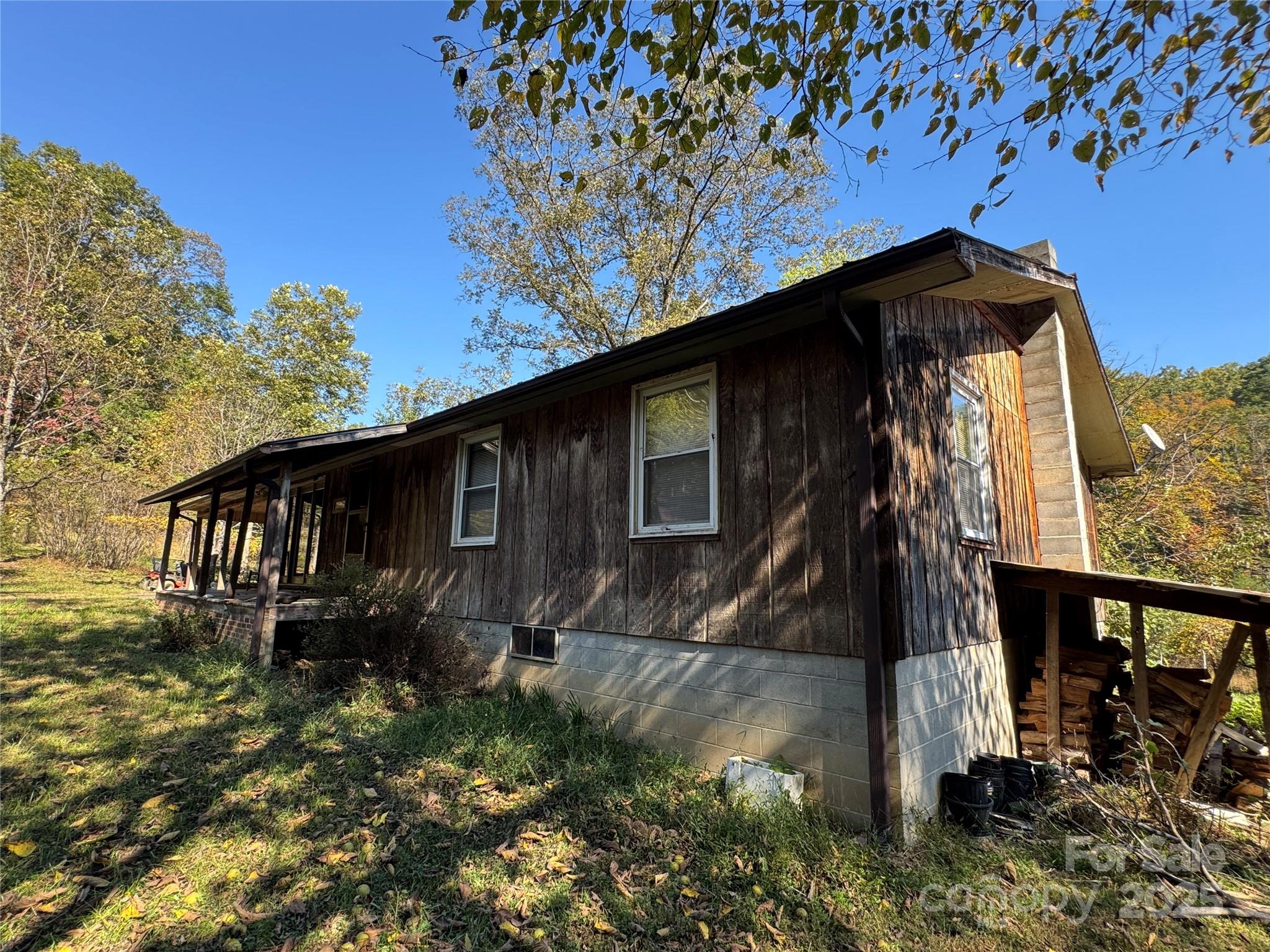 147 Helton Lane Mill Spring, NC 28756 - Photo 5 of 25 a house with trees in the background