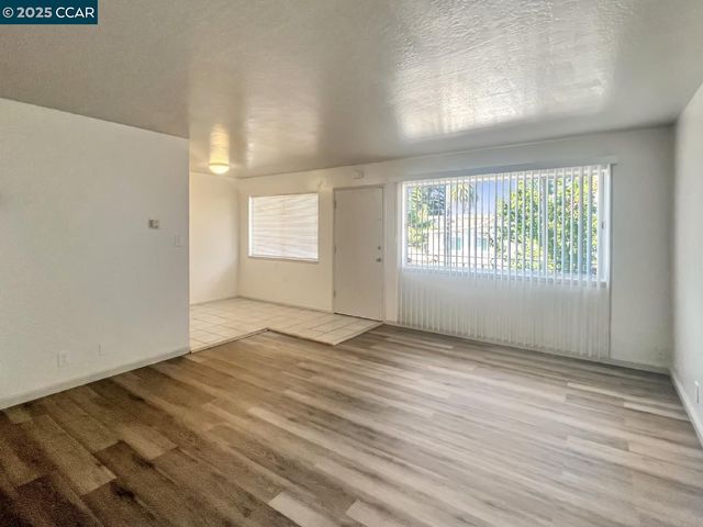 a kitchen that has a sink and a stove