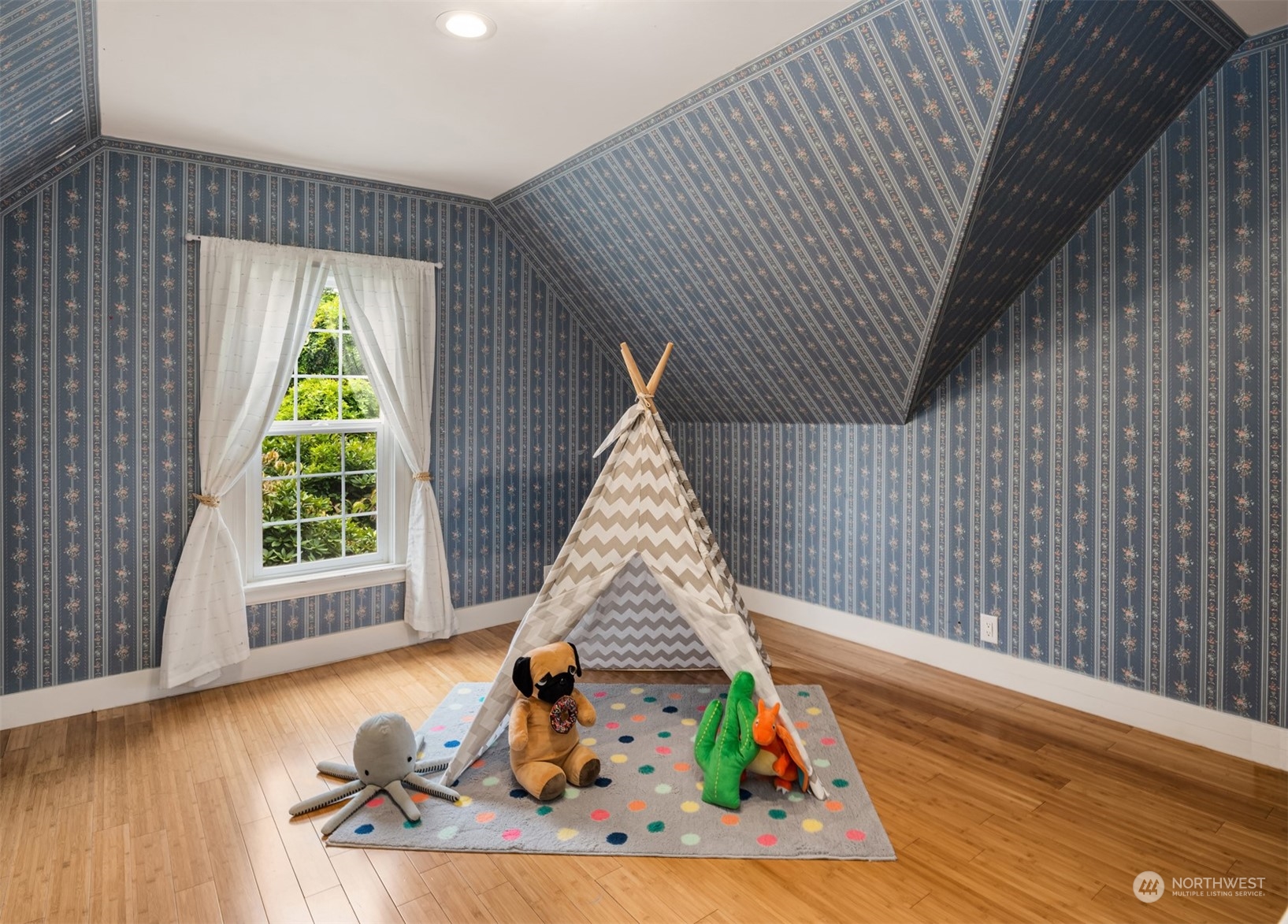 537 Williams Avenue North Renton, WA 98057 - Photo 12 of 18 a view of a bedroom with wooden floor and a window