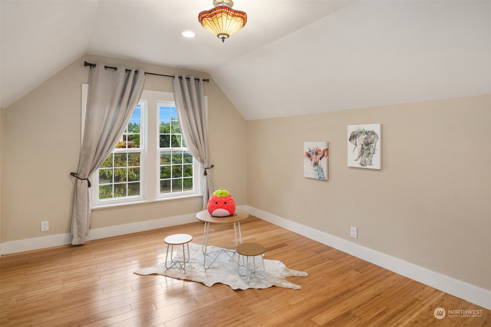 537 Williams Avenue North Renton, WA 98057 - Photo 14 of 18 a view of a room with wooden floor and windows