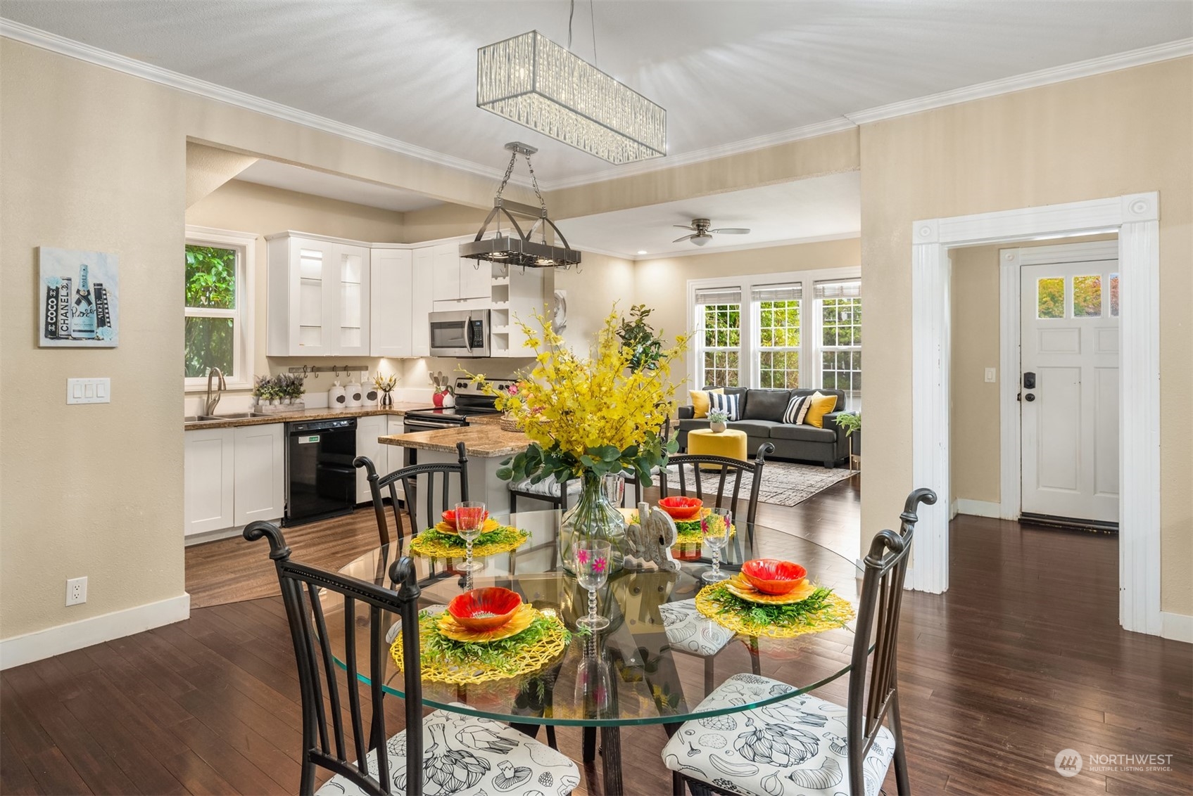 537 Williams Avenue North Renton, WA 98057 - Photo 3 of 18 a view of a dining room with furniture and wooden floor