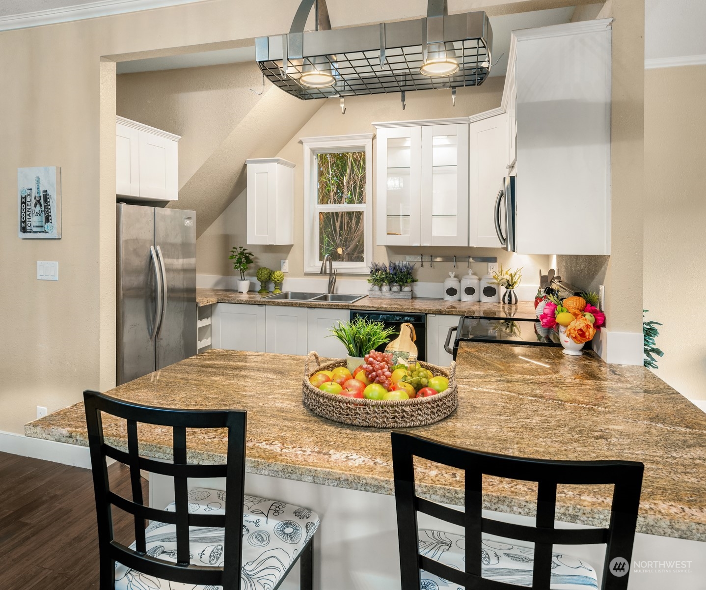 537 Williams Avenue North Renton, WA 98057 - Photo 4 of 18 a kitchen with a dining table and chairs