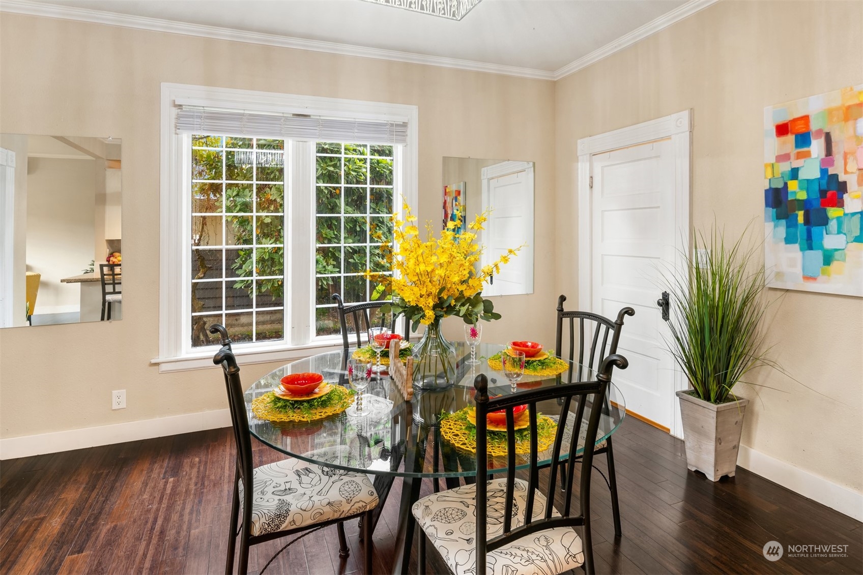 537 Williams Avenue North Renton, WA 98057 - Photo 7 of 18 a dining room with furniture potted plants and wooden floor