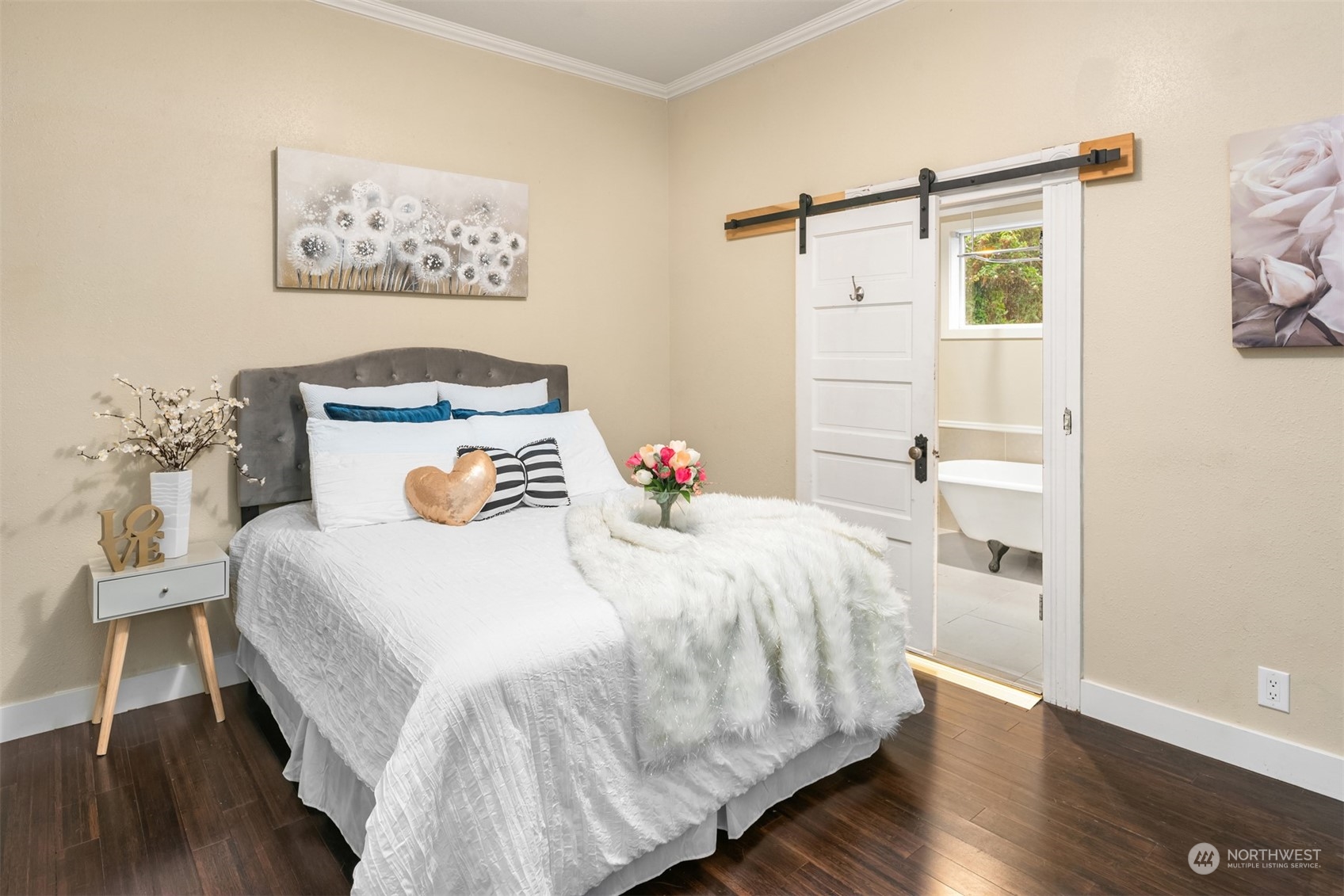 537 Williams Avenue North Renton, WA 98057 - Photo 8 of 18 a bedroom with a bed and a wooden floor