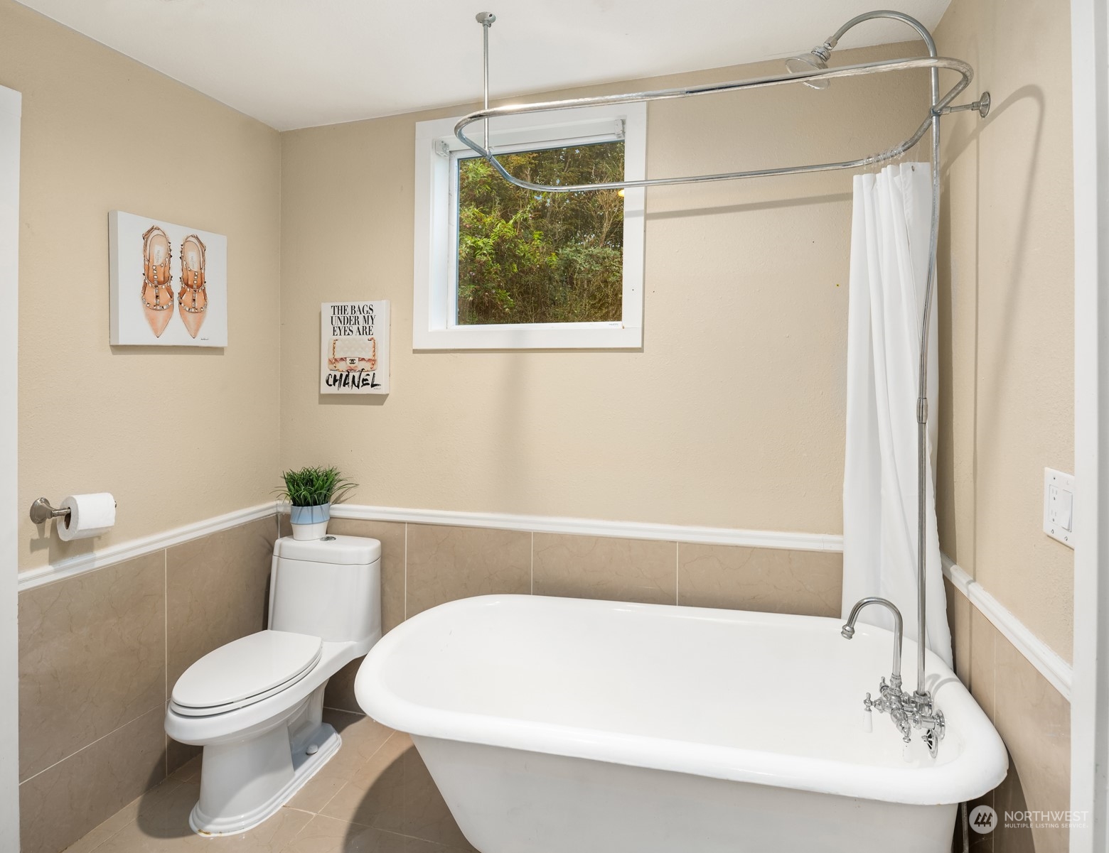537 Williams Avenue North Renton, WA 98057 - Photo 10 of 18 a white bath tub sitting next to a white toilet