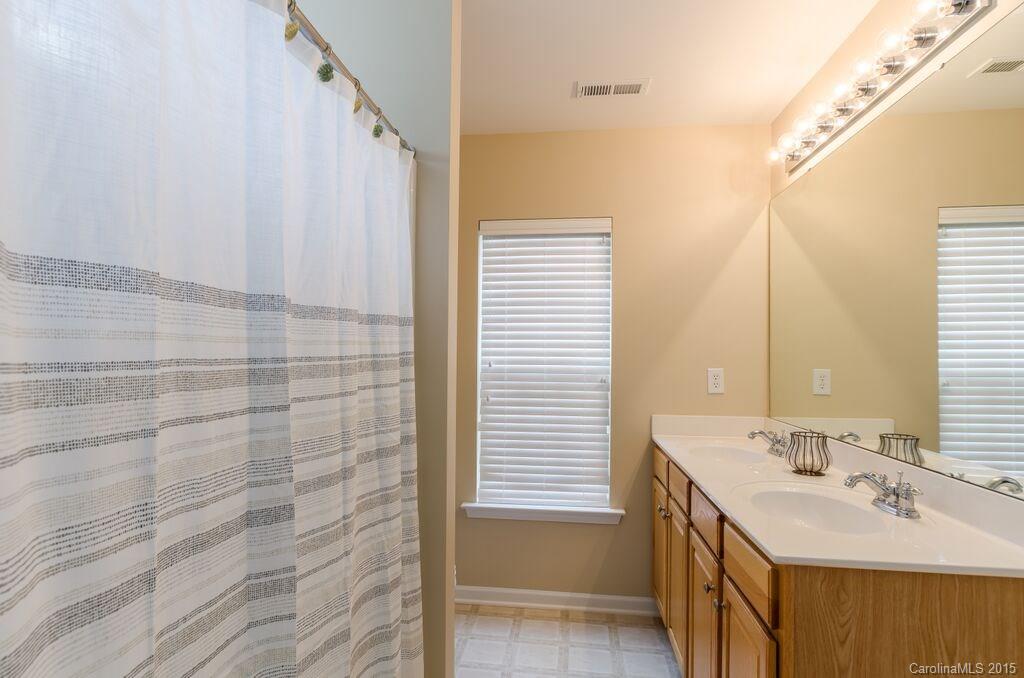 10012 Caldwell Depot Road Cornelius, NC 28031 - Photo 13 of 20 a bathroom with a sink and a mirror