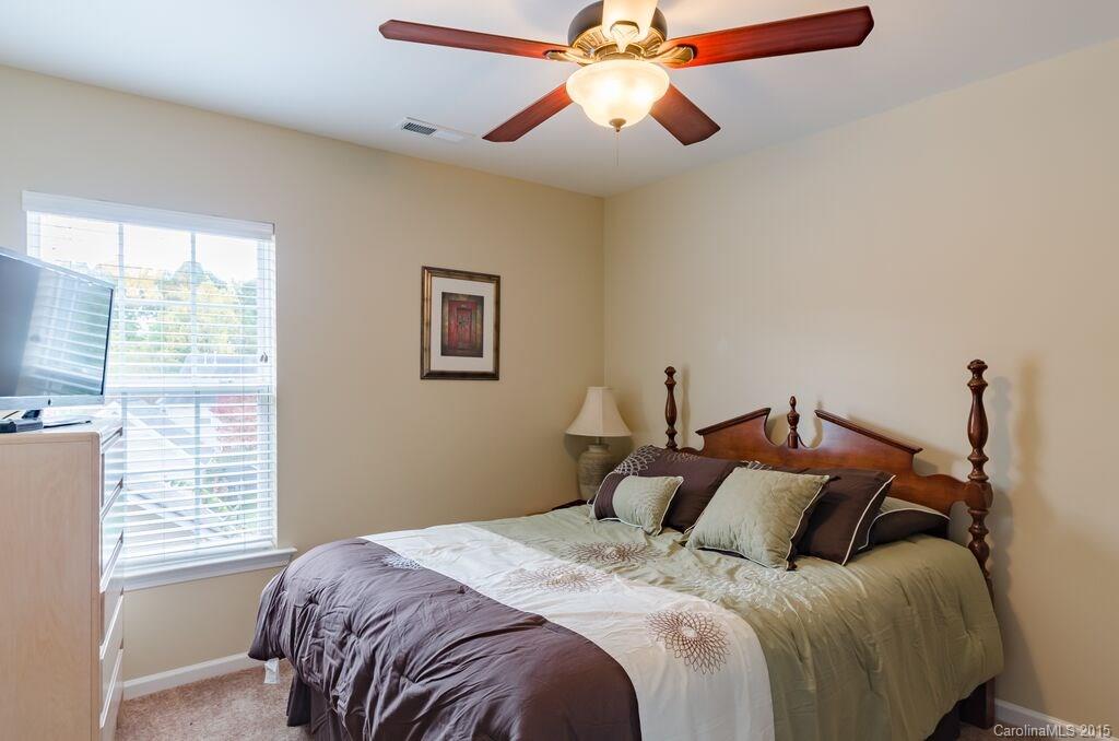 10012 Caldwell Depot Road Cornelius, NC 28031 - Photo 14 of 20 a bedroom with bed and window