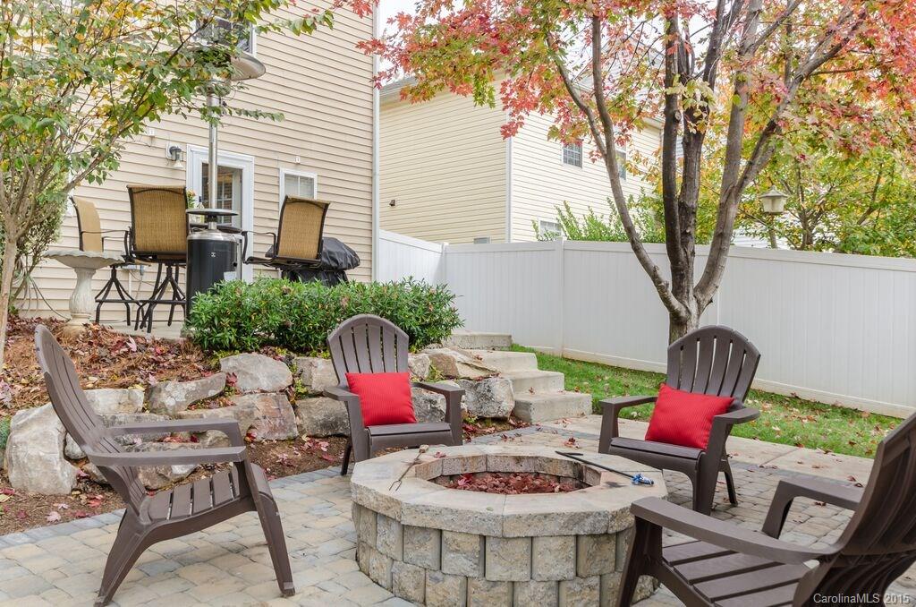 10012 Caldwell Depot Road Cornelius, NC 28031 - Photo 18 of 20 a view of a patio with couches table and chairs and potted plants